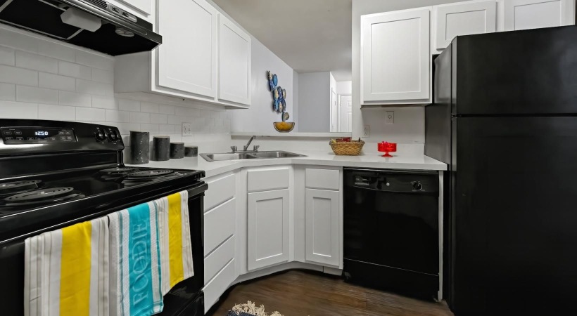 a kitchen with white cabinets