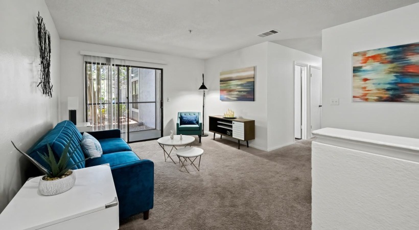 a living room with a blue couch