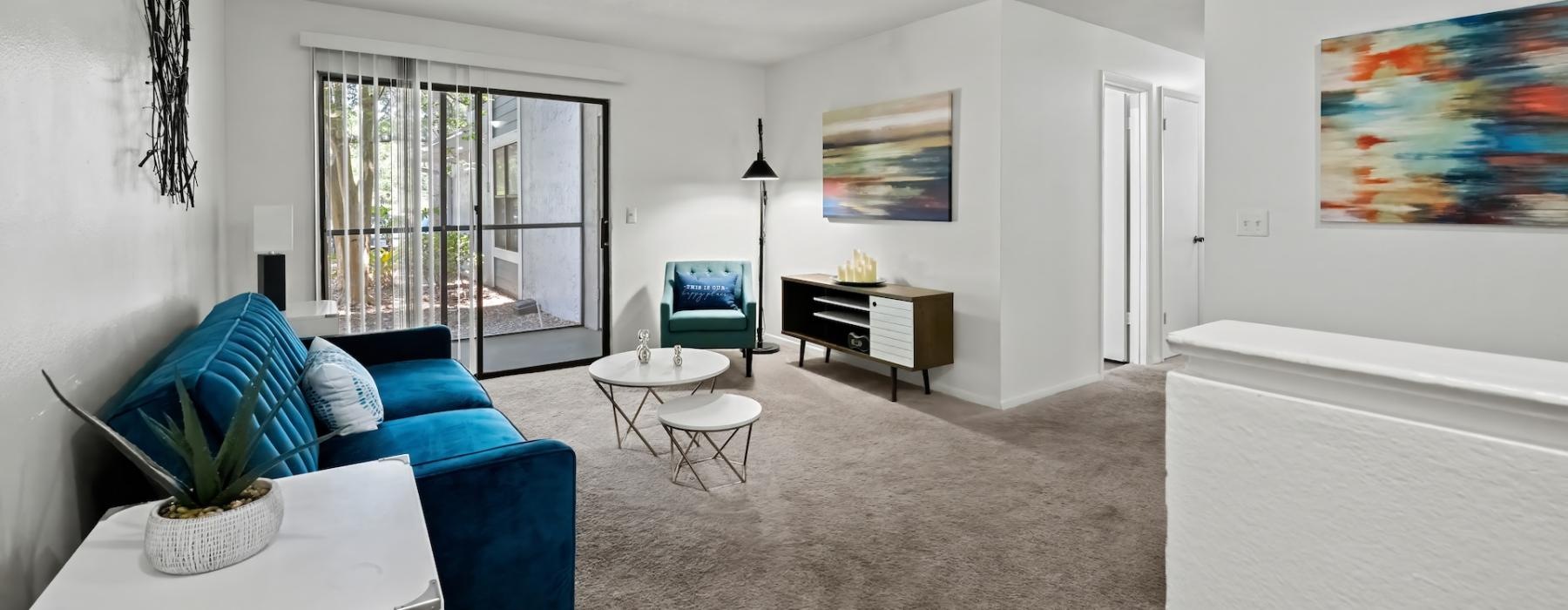 a living room with a blue couch
