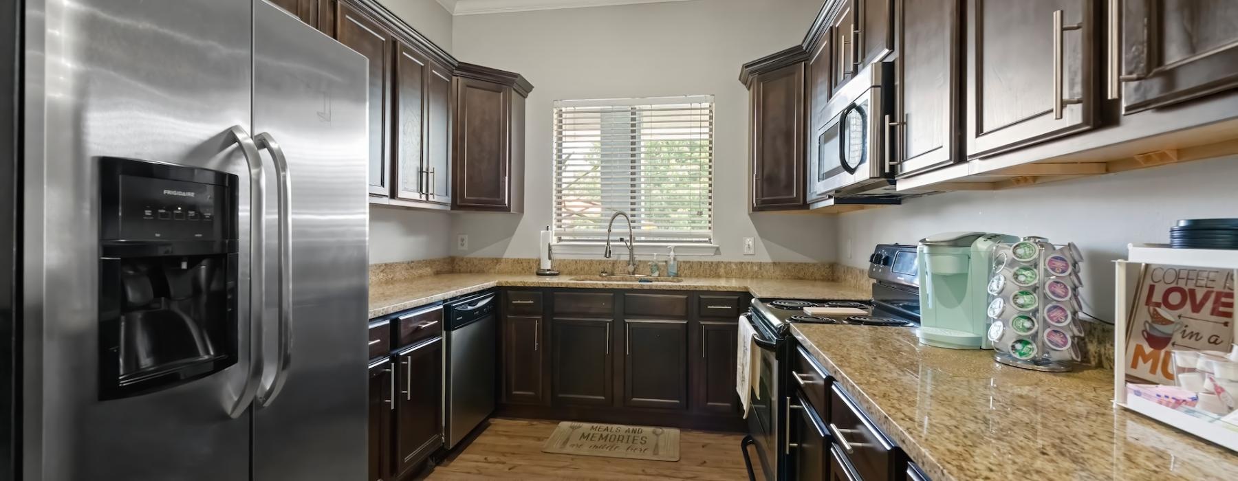 a kitchen with black appliances